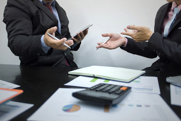 Teamwork process, business people working in the office discussing documents and ideas at meeting