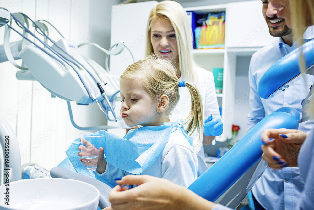 Wall mural family in dental office