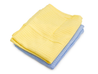Two folded blue and yellow waffle towels