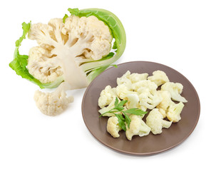 Frozen cauliflower on the brown dish against of fresh cauliflower