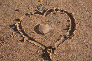 Fototapeta na wymiar Heart on the sand