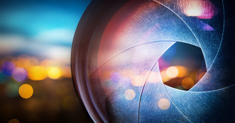 Camera lens on blur night city 