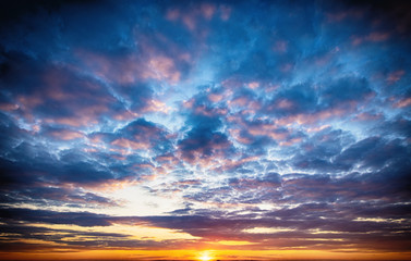 Sunset sunrise with clouds, light rays.