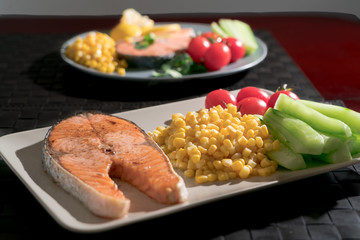 grilled fish salmon fillet with fresh vegetable, food and vegetable concept