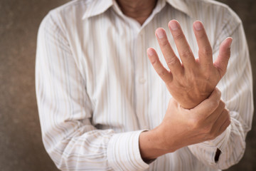 senior man suffering from wrist carpal tunnel syndrome cps or injury, old man with osteoporosis, arthritis, injury, inflammation, gout, rheumatoid symptoms