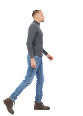 Fototapeta premium Back view of going handsome man. walking young guy .