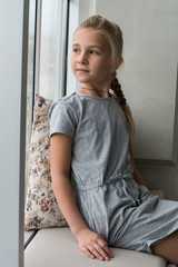 Young girl by the window