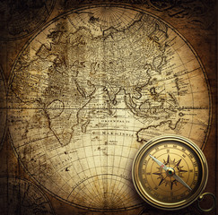Compass on vintage map. Adventure, travel, stories background. 