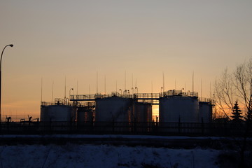 Refinery`s tank in sunset. Europe. Poland. January 2018.