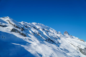 Fototapeta na wymiar landscape big mountains snow covered blue sky background