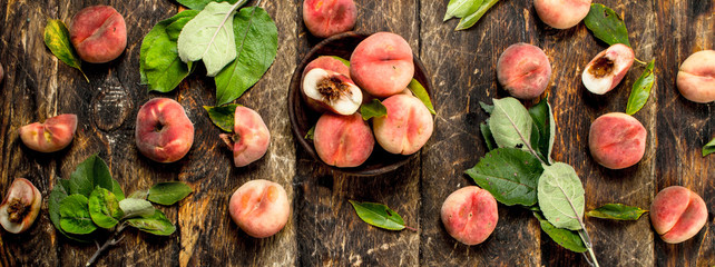 Fresh peaches with leaves.
