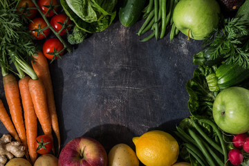 Different fresh vegetables on rough table