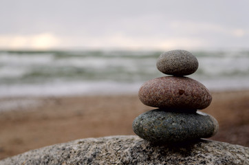Stacked stones in front of the sea