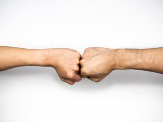 Fist bump on white background, close up