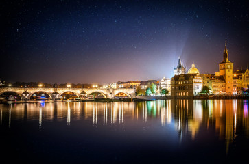 Naklejka premium It's evening in the city of Prague. View of the Charles bridge and star. Czech Republic.