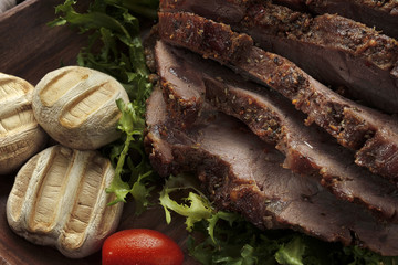 Assorted delicious grilled meat with vegetable over the coals on a barbecue