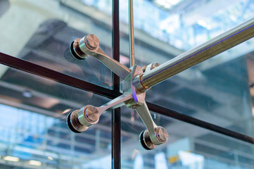 Metal mount with fasteners elements of spider glass system for glass walls.