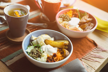 vegetarian lunch bowl in a cafe, a cup of tea and coffee