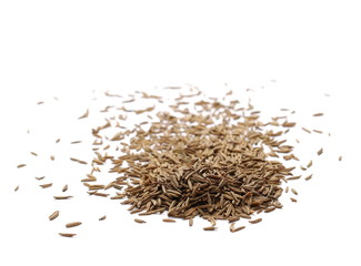 Pile of cumin seeds isolated on white background