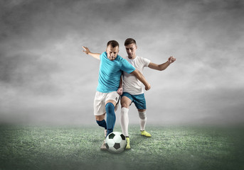 Fototapeta premium Soccer player on a football field in dynamic action at summer da