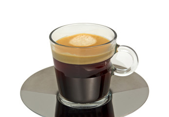 Espresso glass cup fill with fresh coffee isolated on white