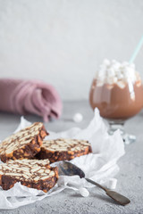 Pieces of chocolate cake from cookies and cocoa with marshmallow on bakery paper