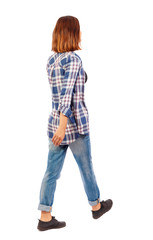 Fototapeta premium back view of walking woman.