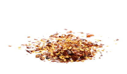 Crushed dry, spicy pepper, chili flakes and seeds isolated on white background