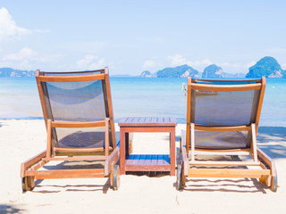 Beach chairs with beautiful sand beach. Travel Concept.