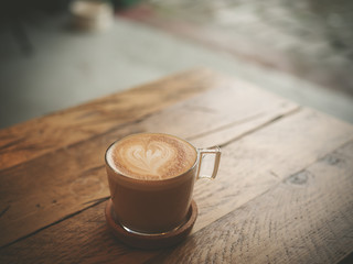 Cup of coffee on wooden table