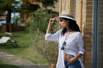 Beautiful woman resting in the summer the Italian garden