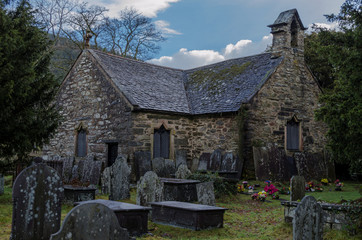 Fototapeta na wymiar The historic St Michaels church and grave yard on the edge of the North Wales village Betws y Coed