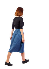 back view of walking  woman.