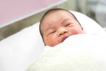 Little Asian infant newborn baby in the hospital