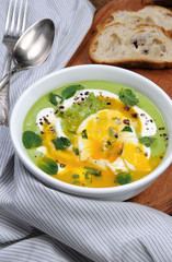 Pea puree soup with poached egg  and peppermint