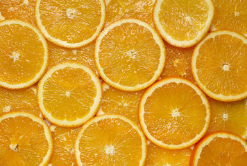 The background is crumbled with fresh whole oranges sliced slices