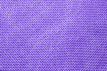 Knit texture of violet wool knitted fabric with pattern, place for text. Modern color of the year 18-3838