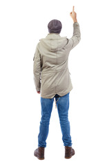Back view of  pointing young men in  shirt and jeans.