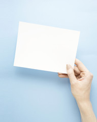 Obraz premium To do list / Creative concept photo of hand with list on blue background.