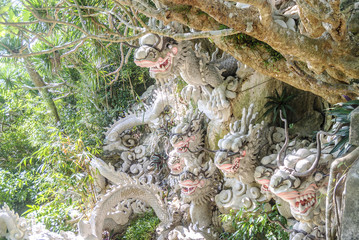 sculpture in the shape of head of dragons in the marble mountains in Vietnam.