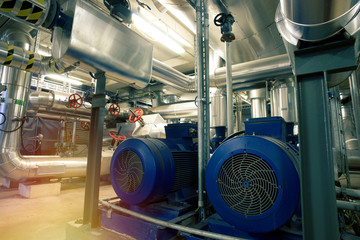Fototapeta premium different size and shaped pipes, valves and pumps at a power plant