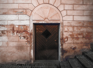 Old building grunge facade, wooden door