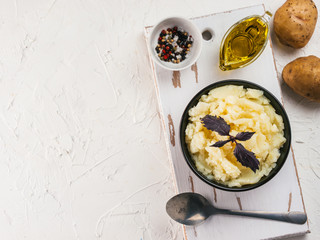 Mashed potatoes on white concrete background