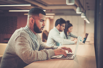 Young specialists in coworking office