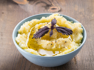 Mashed potatoes on wooden background