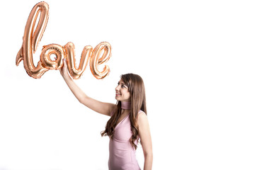 Beautiful millennial female fashion model in stylish clothes posing for 14 february valentines day...