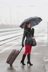 Young woman waiting for a train in the station