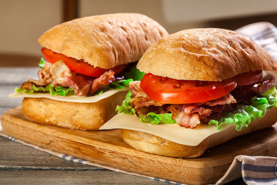 Ciabatta sandwich with smoked bacon, cheese and tomato