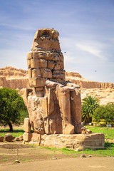 The Colossi of Memnon, two massive stone statues of Pharaoh Amenhotep III near Luxor, Egypt