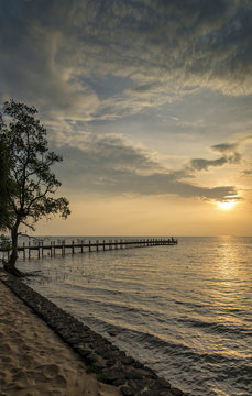 sunset and pier in kep on cambodia coast